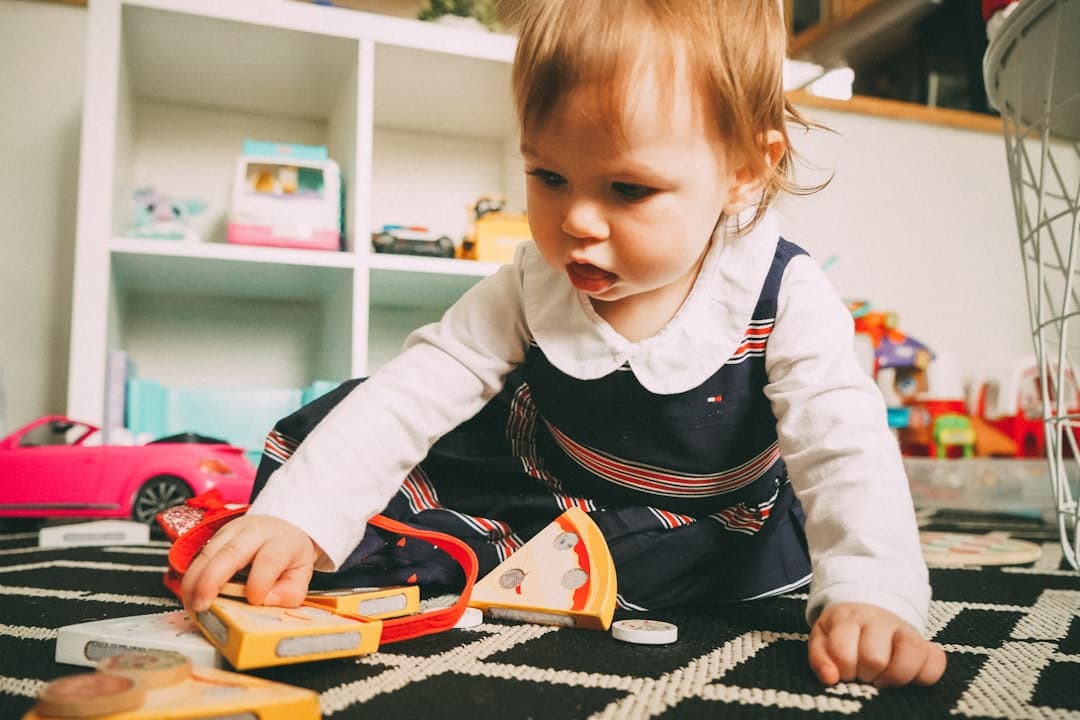 Toddler exploring with a toy